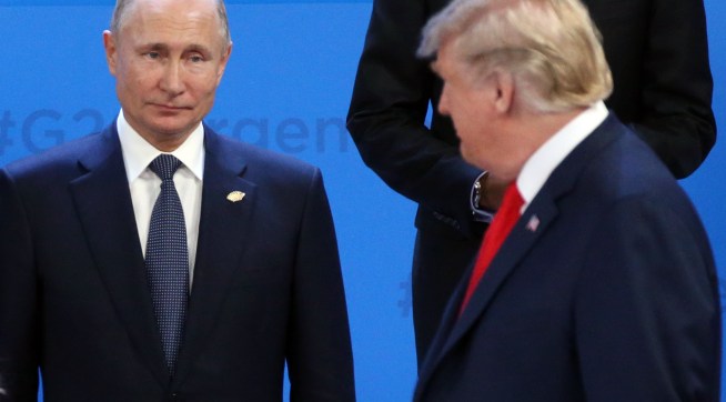 BUENOS AIRES, ARGENTINA - NOVEMBER,30 (RUSSIA OUT) U.S. President Donald Trump (R) looks on Russian President Vladimir Putin (L) during the family photo at the G20 Summit's Plenary Meeting in Buenos Aires, Argentina, November,30,2018. U.S.Preisident Donald Trump has cancelled his meeting with Vladimir Putin at the G20 Summit in Argentina planned on Saturday. (Photo by Mikhail Svetlov/Getty Image
