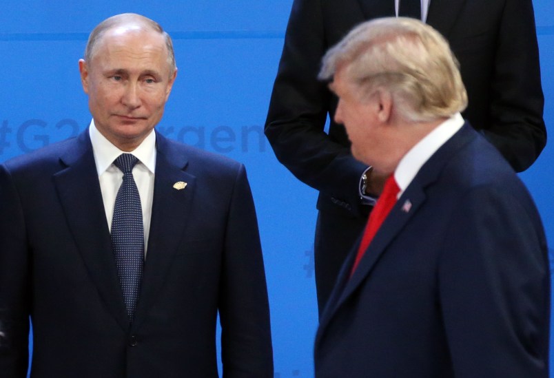 BUENOS AIRES, ARGENTINA - NOVEMBER,30 (RUSSIA OUT) U.S. President Donald Trump (R) looks on Russian President Vladimir Putin (L) during the family photo at the G20 Summit's Plenary Meeting in Buenos Aires, Argentina, November,30,2018. U.S.Preisident Donald Trump has cancelled his meeting with Vladimir Putin at the G20 Summit in Argentina planned on Saturday. (Photo by Mikhail Svetlov/Getty Image