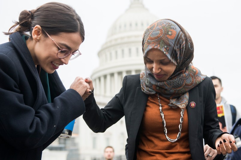 UNITED STATES - FEBRUARY 07: Reps. Alexandria Ocasio-Cortez, D-N.Y., left, and Ilhan Omar, D-Minn., attend a rally on the East Front of the Capitol to call on Congress to defund Immigration and Customs Enforcement (ICE) and U.S. Customs and Border Protection (CBP) on Thursday, February 7, 2019. (Photo By Tom Williams/CQ Roll Call)