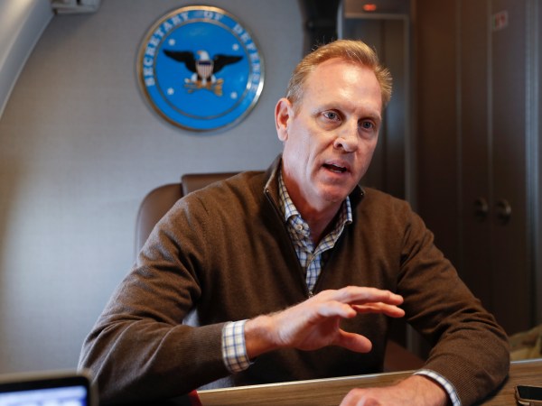 Acting Secretary of Defense Patrick Shanahan gestures while speakings to members of the media aboard a military plane prior to his arrival at Andrews Air Force Base, Md., Saturday, Feb. 23, 2019. Shanahan spoke about the US-Mexico border after visiting the El Paso, Texas area. (AP Photo/Pablo Martinez Monsivais, pool)