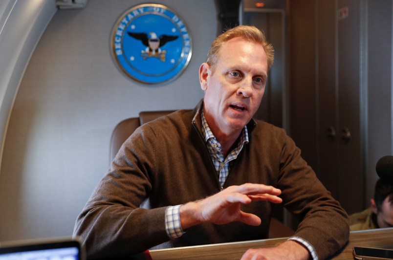 Acting Secretary of Defense Patrick Shanahan gestures while speakings to members of the media aboard a military plane prior to his arrival at Andrews Air Force Base, Md., Saturday, Feb. 23, 2019. Shanahan spoke about the US-Mexico border after visiting the El Paso, Texas area. (AP Photo/Pablo Martinez Monsivais, pool)