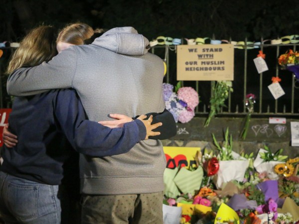 CHRISTCHURCH, CANTERBURY, NEW ZEALAND - 2019/03/17: People seen comforting themselves while paying respect to the victims of the Christchurch mosques shooting. Around 50 people has been reportedly killed in the Christchurch mosques terrorist attack shooting targeting the Masjid Al Noor Mosque and the Linwood Mosque. (Photo by Adam Bradley/SOPA Images/LightRocket via Getty Images)