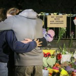 CHRISTCHURCH, CANTERBURY, NEW ZEALAND - 2019/03/17: People seen comforting themselves while paying respect to the victims of the Christchurch mosques shooting. Around 50 people has been reportedly killed in the Christchurch mosques terrorist attack shooting targeting the Masjid Al Noor Mosque and the Linwood Mosque. (Photo by Adam Bradley/SOPA Images/LightRocket via Getty Images)