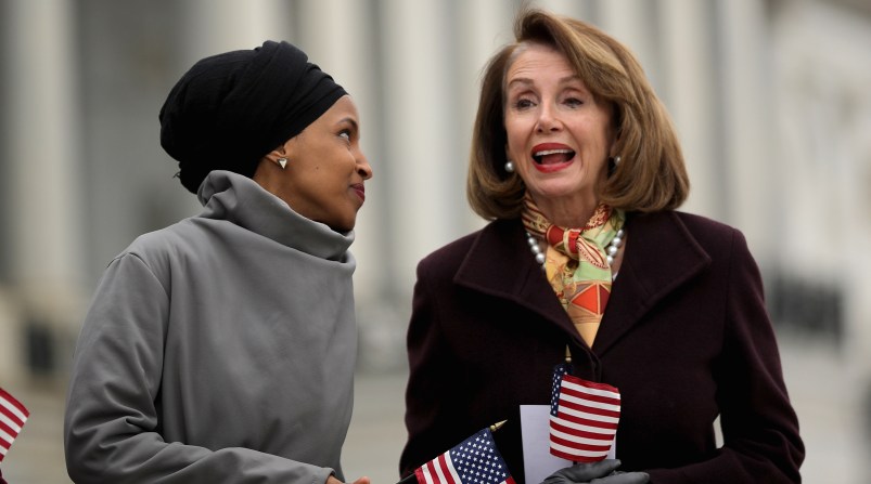 WASHINGTON, DC - MARCH 08: Rep. Ilhan Omar (D-MN) (L) talks with Speaker of the House Nancy Pelosi (D-CA) during a rally with fellow Democrats before voting on H.R. 1, or the People Act, on the East Steps of the U.S. Capitol March 08, 2019 in Washington, DC. With almost zero chance of passing the Senate, H.R. 1 is a package of legislation aimed at bolstering voting rights, reducing corruption in Washington and overhauling the campaign finance system in an effort to reduce the influence of 'special interests.' (Photo by Chip Somodevilla/Getty Images)