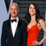 FILE - In this March 4, 2018 file photo, Jeff Bezos and wife MacKenzie Bezos arrive at the Vanity Fair Oscar Party in Beverly Hills, Calif. Bezos says he and his wife, MacKenzie, have decided to divorce after 25 years of marriage. Bezos, one of the world’s richest men, made the announcement on Twitter Wednesday, Jan. 9, 2019. (Photo by Evan Agostini/Invision/AP, File)