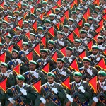 Iran's Revolutionary Guard troops march in a military parade marking the 36th anniversary of Iraq's 1980 invasion of Iran, in front of the shrine of late revolutionary founder Ayatollah Khomeini, just outside Tehran, Iran, Wednesday, Sept. 21, 2016. Iran's chief of staff of the armed forces said Wednesday a $38 billion aid deal between the United States and Israel makes Iran more determined to strengthen its military. In comments broadcast live on Iranian state TV, Gen Mohammad Hossein Bagheri said the U.S.-Israel aid deal "will make us more determined in strengthening the defense power of the country." (AP Photo/Ebrahim Noroozi)