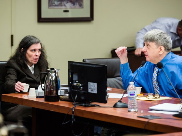 FILE - This {{iptcmonthnameap} 20, 2018, file photo shows Louise Turpin, left, and her husband, David Turpin, right, appear for a preliminary hearing in Superior Court in Riverside, Calif. A California couple who starved a dozen of their children and shackled some to beds face sentencing for years of abuse. David and Louise Turpin are due Friday in Riverside County Superior Court for a proceeding that is largely a formality. The couple pleaded guilty in February to torture and other abuse and agreed to serve at least 25 years in prison.. (Watchara Phomicinda/The Press-Enterprise via AP, File)