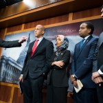 UNITED STATES - JANUARY 10: From left, Sens. Bernie Sanders, I-Vt.,  Cory Booker, D-N.J., Reps. Ilhan Omar, D-Minn., Joe Negues, D-Colo., and Ro Khanna, D-Calif., conduct a news conference in the Capitol to introduce a legislative package that would lower prescription drug prices in the U.S. on January 10, 2019. (Photo By Tom Williams/CQ Roll Call)