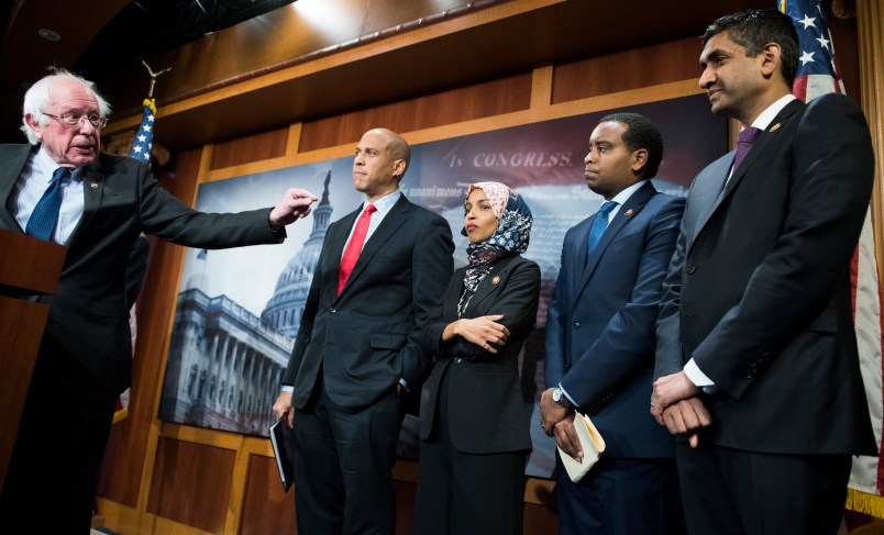 UNITED STATES - JANUARY 10: From left, Sens. Bernie Sanders, I-Vt.,  Cory Booker, D-N.J., Reps. Ilhan Omar, D-Minn., Joe Negues, D-Colo., and Ro Khanna, D-Calif., conduct a news conference in the Capitol to introduce a legislative package that would lower prescription drug prices in the U.S. on January 10, 2019. (Photo By Tom Williams/CQ Roll Call)