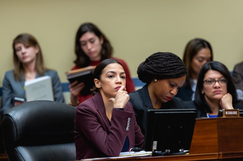 (L-R) Rep. Alexandria Ocasio-Cortez (D-NY), Rep. Ayanna Pressley (D-MA), and Rep. Rashida Tlaib (D-MI), listen as Michael Cohen, former lawyer for U.S. President Donald Trump, testifies before the House Oversight Committee on Capitol Hill, on Wednesday, February 27, 2019. (Photo by Cheriss May/NurPhoto)