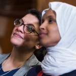 UNITED STATES - MARCH 13: Reps. Ilhan Omar, D-Minn., right, and Rashida Tlaib, D-Mich., attend a rally with Democrats in the Capitol to introduce the "Equality Act," which will amend existing civil rights legislation to bar discrimination based on gender identification and sexual orientation on Wednesday, March 13, 2019. (Photo By Tom Williams/CQ Roll Call)