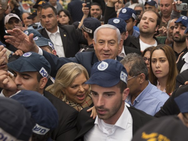 TEL AVIV, ISRAEL - APRIL 02:  Israeli Prime Minster Benjamin Netanyahu and his wife Sara Netanyahu gesture to supporters as they visit Tel Aviv's vegetable market Hatikva on April 2, 2019 in Tel Aviv, Israel.  (Photo by Amir Levy/Getty Images)
