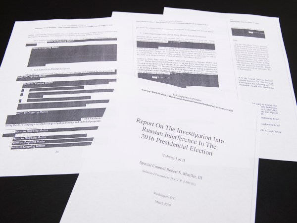 UNITED STATES - APRIL 18: Media films a few pages of special counsel Robert Mueller's report on Russian interference in the 2016 election which was printed out by staff in the House Judiciary Committee's hearing room on Thursday, April 18, 2019. (Photo By Tom Williams/CQ Roll Call)