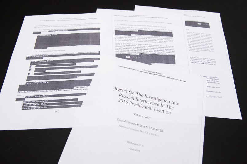 UNITED STATES - APRIL 18: Media films a few pages of special counsel Robert Mueller's report on Russian interference in the 2016 election which was printed out by staff in the House Judiciary Committee's hearing room on Thursday, April 18, 2019. (Photo By Tom Williams/CQ Roll Call)