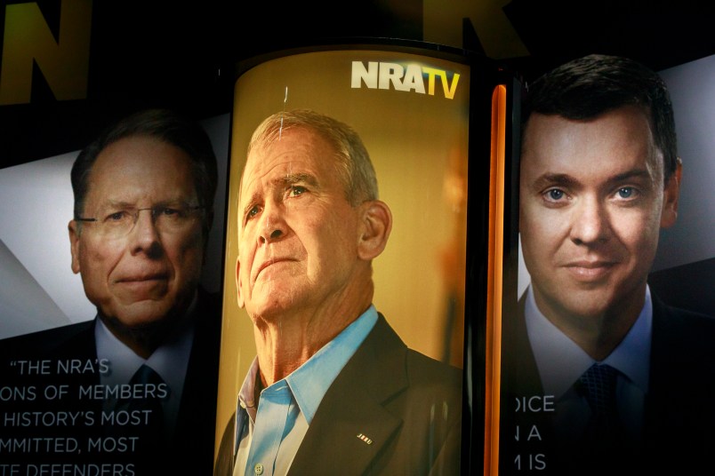 INDIANAPOLIS, INDIANA, UNITED STATES - 2019/04/27: Photos of NRA Chief Executive and Executive Vice President Wayne LaPierre, (L), former president of the NRA Oliver North (M) and chief lobbyist and principal political strategist for the Institute for Legislative Action Chris Cox (R) are on display during the during the third day of the National Rifle Association convention being held nearby. (Photo by Jeremy Hogan/SOPA Images/LightRocket via Getty Images)