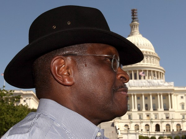 WASHINGTON, DC - APRIL 16:  Former Republican presidential candidate Herman Cain waits to speak at the "Cain's Revolution on the Hill" Tax Day Rally at the U.S. Capitol April 16, 2012 in Washington, DC. Cain spent the day promoting his 9-9-9 tax code plan in advance of tomorrow, the day that Americans are required to file their income taxes this year.  (Photo by Win McNamee/Getty Images)