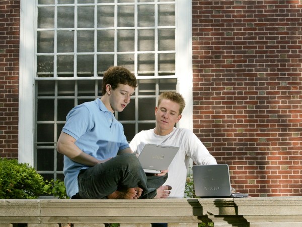 Mark Zuckerberg (L) and Chris Hughes (R)   creaters  "Facebook" photographed at  Eliot House at Harvard University, Cambridge, MA. on May 14, 2004.    Facebook was created in February 2004,  3 months prior to this photograph.