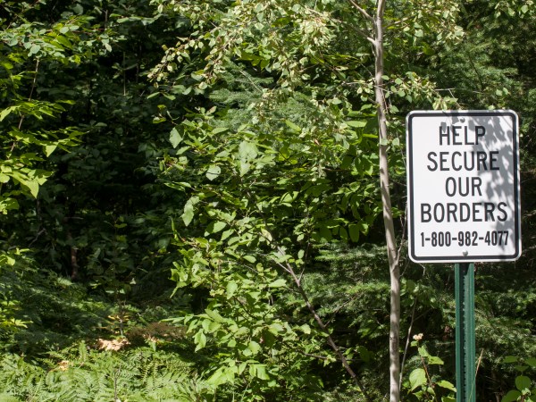 Grand Marais, Minnesota. Secure our border sign on a trail that leads to Canada through the Superior National Forest.