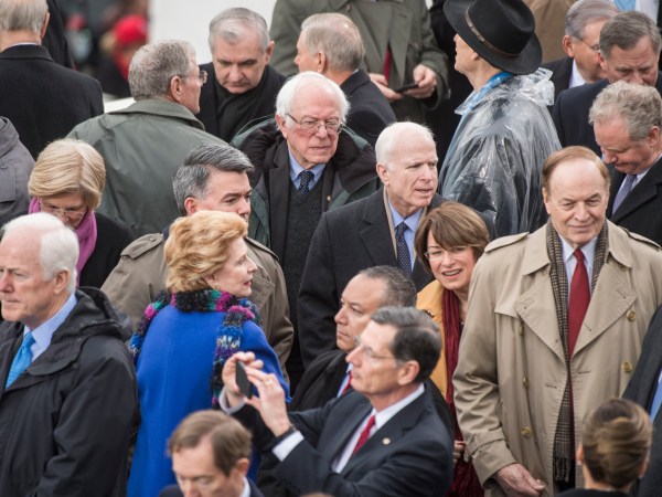 UNITED STATES - JANUARY 20: Senators including Bernie Sanders, I-Vt., center and John McCain, R-Ariz., are seen on the West Front of the Capitol before Donald J. Trump was sworn in as the 45th President of the United States, January 20, 2017. (Photo By Tom Williams/CQ Roll Call)