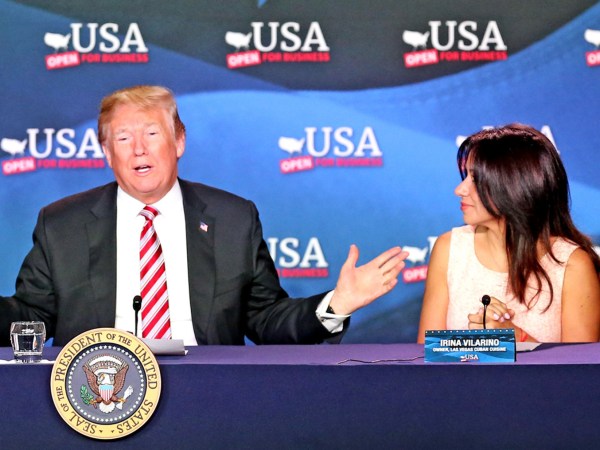 U.S. President Donald Trump, flanked by Maximo Alvarez and Irina Vilarino, talks at a Roundtable Discussion on Tax Reform on Monday, April 16, 2018 at Bucky Dent Park in Hialeah, Fla. (Charles Trainor Jr./Miami Herald/TNS)