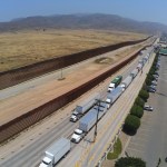 TIJUANA, MEXICO - MAY 31: Trucks wait in line to enter the United States on May 31, 2019 in Tijuana, Mexico. President Donald Trump has proposed a 5% tariff on Mexican goods entering the U.S. unless they help stop illegal immigration. (Photo by Sandy Huffaker/Getty Images)