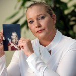 Virginia Roberts holds a photo of herself at age 16, when she says Palm Beach multimillionaire Jeffrey Epstein began abusing her sexually.(Emily Michot/Miami Herald/TNS)