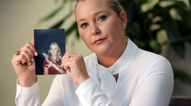 Virginia Roberts holds a photo of herself at age 16, when she says Palm Beach multimillionaire Jeffrey Epstein began abusing her sexually.(Emily Michot/Miami Herald/TNS)