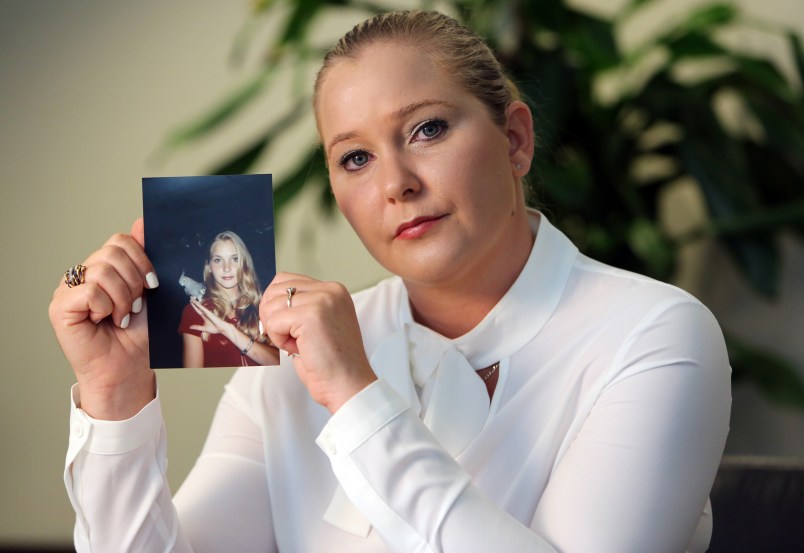 Virginia Roberts holds a photo of herself at age 16, when she says Palm Beach multimillionaire Jeffrey Epstein began abusing her sexually.(Emily Michot/Miami Herald/TNS)
