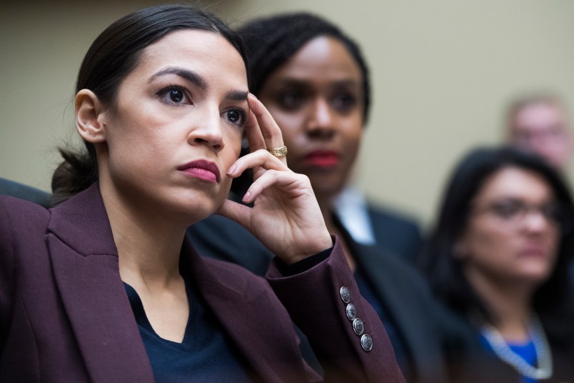 UNITED STATES - FEBRUARY 27: From left, Reps. Alexandria Ocasio-Cortez, D-N.Y., and Ayanna Pressley, D-Mass., and Rashida Tlaib, D-Mich., are seen during a House Oversight and Reform Committee hearing in Rayburn Building featuring testimony by Michael Cohen, former attorney for President Donald Trump, on Russian interference in the 2016 election on Wednesday, February 27, 2019. (Photo By Tom Williams/CQ Roll Call)