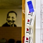 DOWNTOWN COLUMBUS, COLUMBUS, OHIO, UNITED STATES - 2018/11/06: Stickers with the words I love voting are at the entrance of Barrack Recreation Centre polling stationVoters turned up to cast their ballots in the 2018 Primary election in Ohio. (Photo by Matthew Hatcher/SOPA Images/LightRocket via Getty Images)