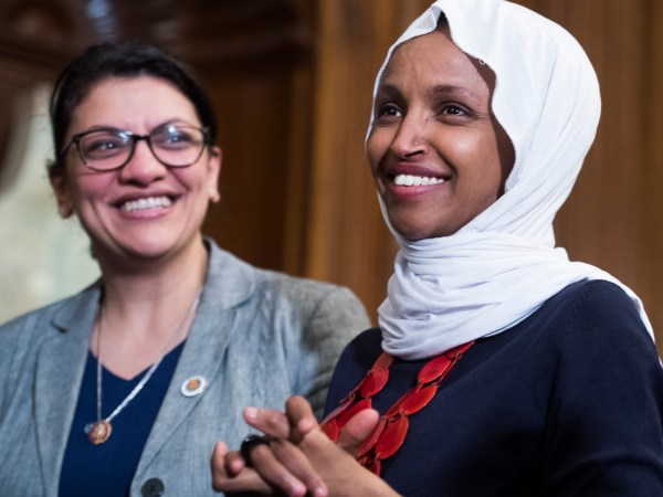 UNITED STATES - MARCH 13: Reps. Ilhan Omar, D-Minn., right, and Rashida Tlaib, D-Mich., attend a rally with Democrats in the Capitol to introduce the "Equality Act," which will amend existing civil rights legislation to bar discrimination based on gender identification and sexual orientation on Wednesday, March 13, 2019. (Photo By Tom Williams/CQ Roll Call)