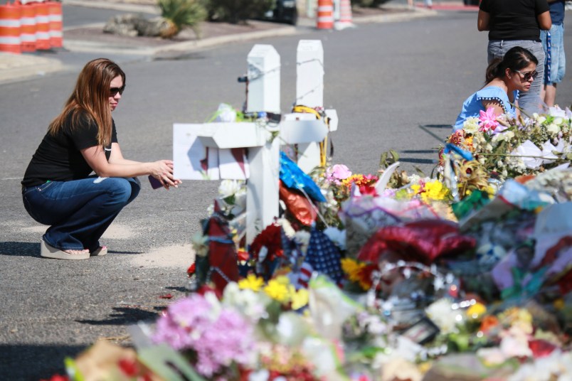 EL PASO, TX - AUGUST 15:  People gather at a makeshift memorial honoring victims outside Walmart, near the scene of a mass shooting which left at least 22 people dead, on August 15, 2019 in El Paso, Texas. A 21-year-old white male suspect remains in custody in El Paso which sits along the U.S.-Mexico border. (Photo by Sandy Huffaker/Getty Images)