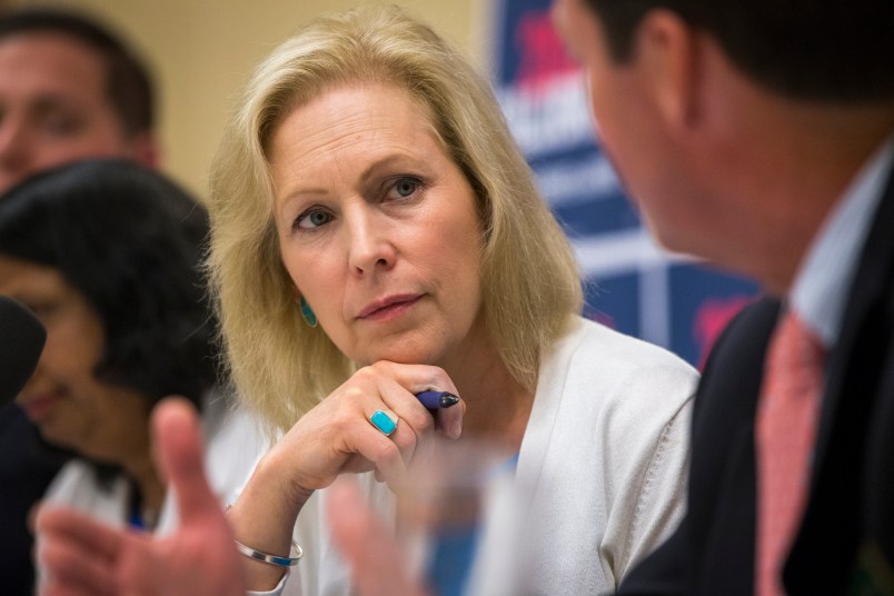 Manchester, NH, - 8/20/2019 - Senator Kirsten Gillibrand listens to Senator Tom Sherman speak during the mental health table discussion at Amoskeag Health in Manchester, N.H. on Tuesday, Aug. 20. (Nic Antaya for The Boston Globe) Topic: 21candidates