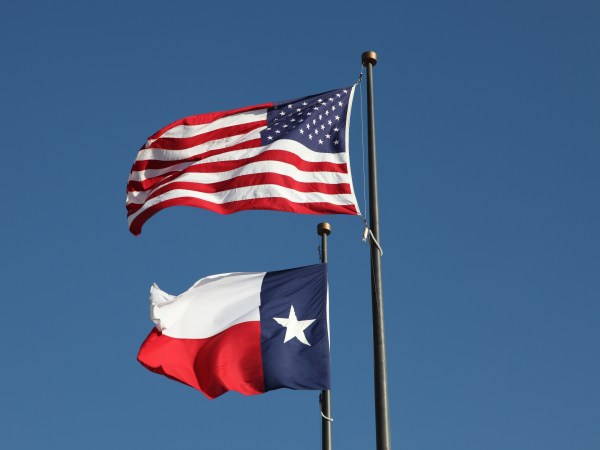 American flag and Texas flag flying at the  LBJ Library in Austin.