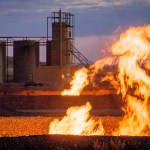 Flames from a flaring pit near a well in the Bakken Oil Field. The primary component of natural gas is methane, which is odorless when it comes directly out of the gas well. In addition to methane, natural gas typically contains other hydrocarbons such as ethane, propane, butane, and pentanes. Raw natural gas may also contain water vapor, hydrogen sulfide (H2S), carbon dioxide, helium, nitrogen, and other compounds. (Source: www.earthworksaction.org). As of July 2014, roughly 30 percent of the one billion cubic feet per day of natural gas produced in North Dakota was being wasted in flares like this, according to the news site Breaking Energy. The reasons are low price on LNG (liquefied natural gas) , lax regulations and lack of infrastructure. In order to put an end to the flaring, North Dakota have adopted new regulations, and the goal is to capture 95 percent of the gas by 2020. On August 18th 2015, EPA announced that the oil and gas sector will have to cut their methane emissions by 40 to 45 percent within the next decade. Methane is a shortlived greenhouse gas compared to CO2, but is 72 times more damaging. That