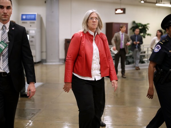 Federal Bureau of Investigation Director Christopher Wray and Director of National Intelligence Daniel Coats arrive to brief members of the so-called 'Gang of Eight' at the U.S. Capitol May 24, 2018 in Washington, DC. The bipartisan group of senators and representatives requested a briefing from the intelligence officials about the FBI's use of a confidential intelligence source in the Russia investigation. The "Gang of Eight" consists of the top Republican and Democratic members of the House and Senate intelligence committee as well as congressional leaders from both parties.
