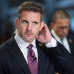 UNITED STATES - JUNE 21: Reps. Adam Kinzinger, R-Ill., left, and Anthony Brown, D-Md., prepare for television interviews in the Capitol on Friday, June 21, 2019. (Photo By Tom Williams/CQ Roll Call)