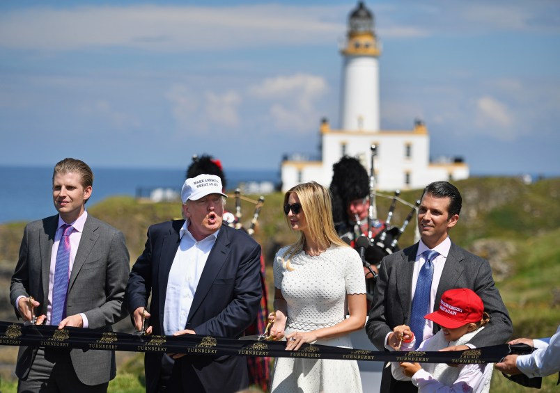 AYR, SCOTLAND - JUNE 24:  Presumptive Republican nominee for US president Donald Trump cuts a ribbon on the 9th tee at his Trump Turnberry Resort surrounded by his family Eric Trump, Ivanka Trump, Donald Trump junior and granddaughter Kai Trump on June 24, 2016 in Ayr, Scotland. Mr Trump arrived to officially open his golf resort which has undergone an eight month refurbishment as part of an investment thought to be worth in the region of two hundred million pounds.  (Photo by Jeff J Mitchell/Getty Images)