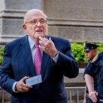MANHATTAN, NEW YORK, NY, UNITED STATES - 2018/05/23: Donald Trump's lawyer Rudy Giuliani caught allegedly giving the finger to a crowd booing him - Hundreds of New Yorkers joined members of Rise and Resist to protest Donald Trump's visit to New York City  outside the Lotte New York Palace Hotel, where he's expected to participate in a roundtable on immigration and then attend dinner with supporters. (Photo by Erik McGregor/LightRocket via Getty Images)