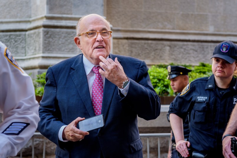 MANHATTAN, NEW YORK, NY, UNITED STATES - 2018/05/23: Donald Trump's lawyer Rudy Giuliani caught allegedly giving the finger to a crowd booing him - Hundreds of New Yorkers joined members of Rise and Resist to protest Donald Trump's visit to New York City  outside the Lotte New York Palace Hotel, where he's expected to participate in a roundtable on immigration and then attend dinner with supporters. (Photo by Erik McGregor/LightRocket via Getty Images)