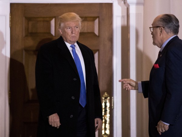 BEDMINSTER TOWNSHIP, NJ - NOVEMBER 20: (L to R) President-elect Donald Trump and former New York City mayor Rudy Giuliani talk to each other as they exit the clubhouse following their meeting at Trump International Golf Club, November 20, 2016 in Bedminster Township, New Jersey. Trump and his transition team are in the process of filling cabinet and other high level positions for the new administration. (Photo by Drew Angerer/Getty Images)