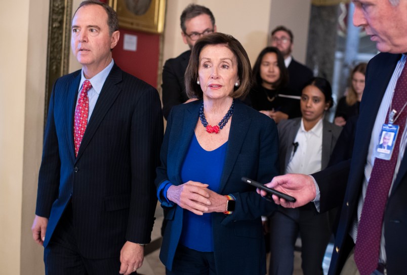 UNITED STATES - OCTOBER 18: Speaker of the House Nancy Pelosi, D-Calif., and House Intelligence Chairman Adam Schiff, D-Calif., make their way to the floor for the last House votes of the week on Friday, October 18, 2019. (Photo By Tom Williams/CQ Roll Call)