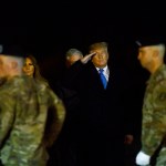 DOVER, DE - NOVEMBER 21:  U.S. President Donald J. Trump and First Lady Melania Trump salute as military personnel carry a transfer case for fallen service member, U.S. Army Chief Warrant Officer 2 Kirk T. Fuchigami, 25, during a dignified transfer at Dover Air Force Base on November 21, 2019 in Dover, Delaware.  Fuchigami died Wednesday along with Chief Warrant Officer 2  David C. Knadle, 33, in Logar province, Afghanistan, when their helicopter crashed while providing security for troops on the ground,  according to a Department of Defense release.  The incident is under investigation.  (Photo by Mark Makela/Getty Images)