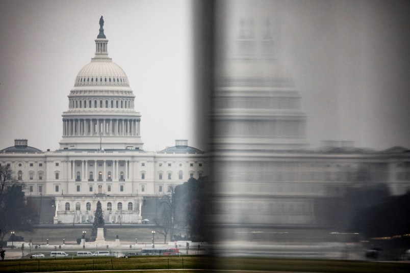 WASHINGTON, DC - DECEMBER 16: The U.S. Capitol is seen in the distance from the base of the Washington Monument on a stormy morning on December 16, 2019 in Washington, DC. Washington is preparing for the House of Representatives to hold the historic vote on the Articles of Impeachment of President Donald Trump later this week. If the vote passes in the House, President Trump will become only the third sitting U.S. President to be impeached in the 243 year history of the United States. (Photo by Samuel Corum/Getty Images)