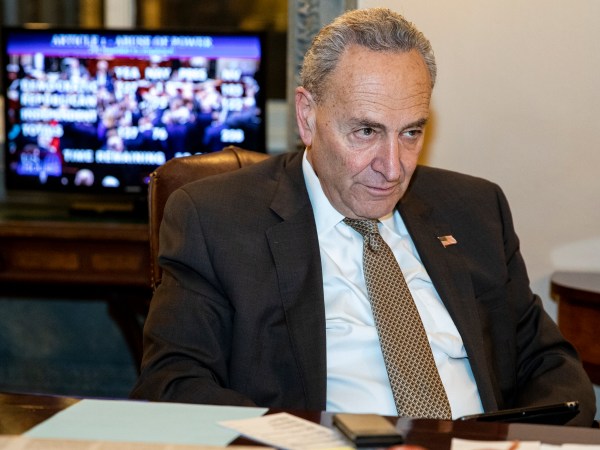 WASHINGTON, DC - DECEMBER 18: Senate Minority Leader Chuck Schumer (D-NY) allows press photographers an opportunity to photograph him watching the House of Representatives vote on the two Articles of Impeachment of President Donald Trump in his office on December 18, 2019 in Washington, DC. After a long process the House has brought two Articles of Impeachment, abuse of power and obstruction of Congress, up for a vote which will send them to the Senate for a trial. (Photo by Samuel Corum/Getty Images) *** Local Caption *** Chuck Schumer