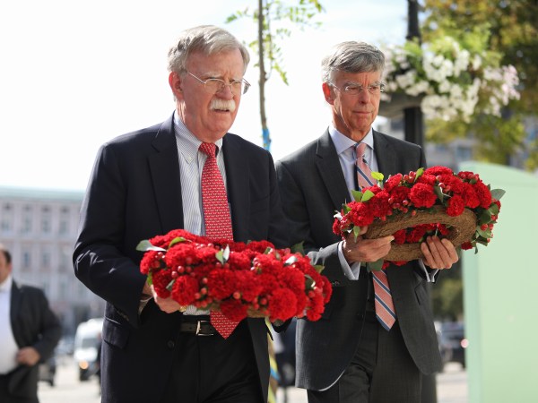 National Security Advisor of the United States John Bolton (L) and US Charge d'Affaires a.i. in Ukraine, Ambassador William Taylor lay wreaths of red carnations at the memorial wall which commemorates those who perished in fighting in Donbas in Mykhailivska Square, Kyiv, capital of Ukraine, August 27, 2019. Ukrinform.