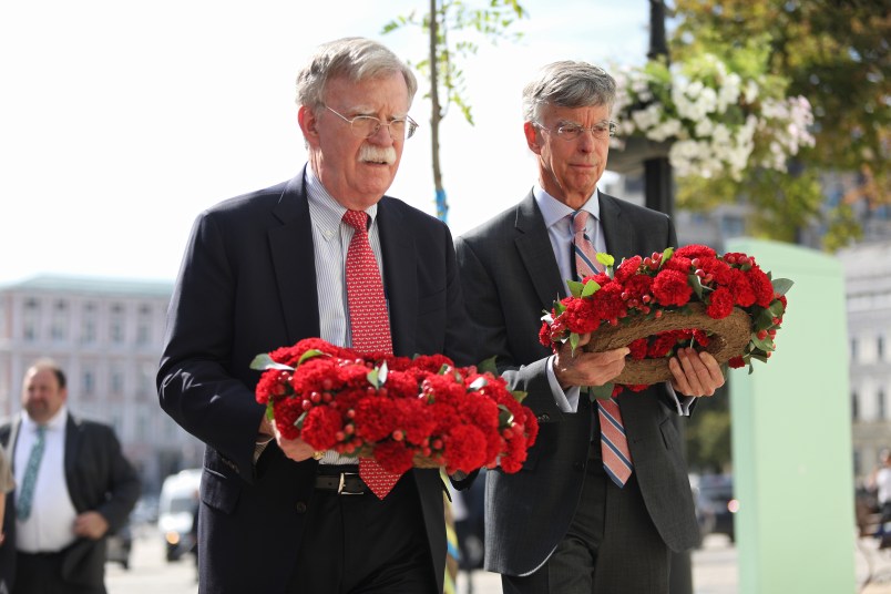 National Security Advisor of the United States John Bolton (L) and US Charge d'Affaires a.i. in Ukraine, Ambassador William Taylor lay wreaths of red carnations at the memorial wall which commemorates those who perished in fighting in Donbas in Mykhailivska Square, Kyiv, capital of Ukraine, August 27, 2019. Ukrinform.