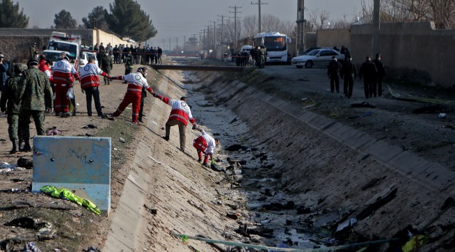 TEHRAN, Jan. 8, 2020 -- Rescuers work at the air crash site of a Boeing 737 Ukrainian passenger plane in Parand district, southern Tehran, Iran, on Jan. 8, 2020. All the passengers and crew members on board the Boeing 737 Ukrainian passenger plane that crashed near Tehran Imam Khomeini International Airport on Wednesday morning are confirmed dead, official Islamic Republic News Agency reported. (Photo by Ahmad Halabisaz/Xinhua via Getty)
