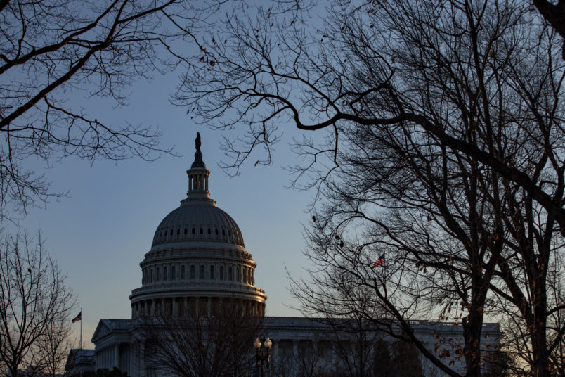 WASHINGTON, DC - JANUARY 29: The sun sets over the U.S. Capitol as the Senate impeachment trial of President Donald Trump continues on January 29, 2020 in Washington, DC. The trial entered the phase today where senators will have the opportunity to submit written questions to the House managers and President Trump's defense team. (Photo by Samuel Corum/Getty Images)