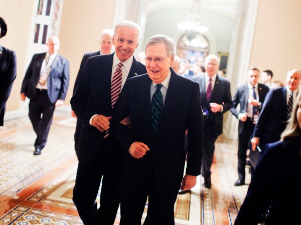 UNITED STATES - JANUARY 12: Vice President Joe Biden, left, and Senate Majority Leader Mitch McConnell, R-Ky., make their way to the House floor for President Obama's State of the Union address, January 12, 2016. (Photo By Tom Williams/CQ Roll Call)